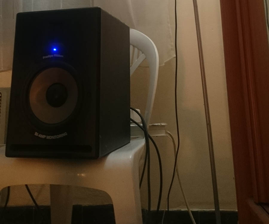 My studio monitors stand on a plastic chair
