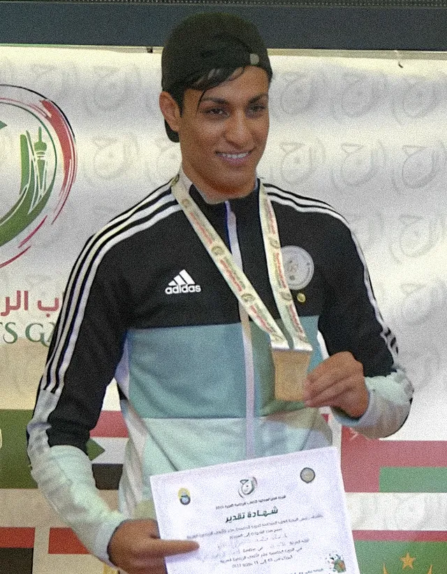 Imane Khelif holding a medal she earned