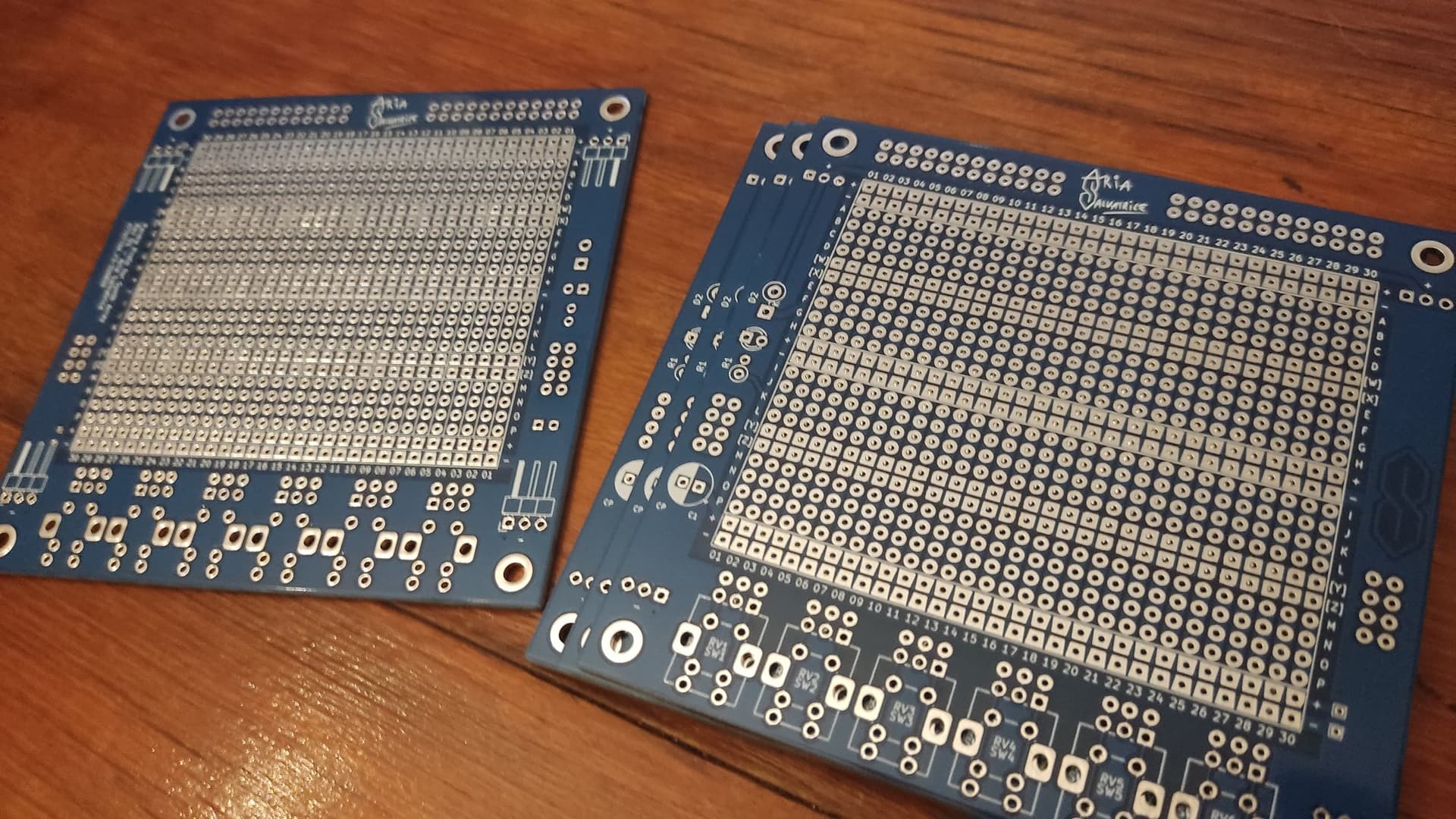 A few protoboard PCBs: they are mostly a grid of holes to which you can solder components.