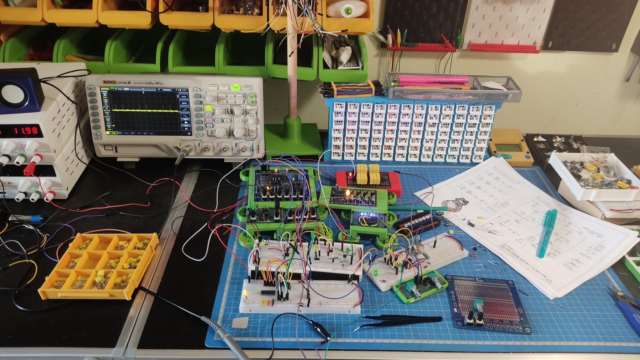 A few modules of the synth are connected to re-usable plastic breadboards using DuPont wires